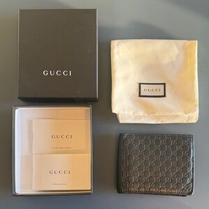 Gucci Black GG Embossed Leather Wallet Men’s | GG Emblem bi-fold wallet, black